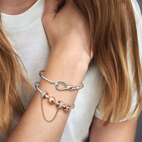 To close the bracelet, place the tip of the bracelet into the groove on the barrel and click shut. . Pandora safety chain bracelet